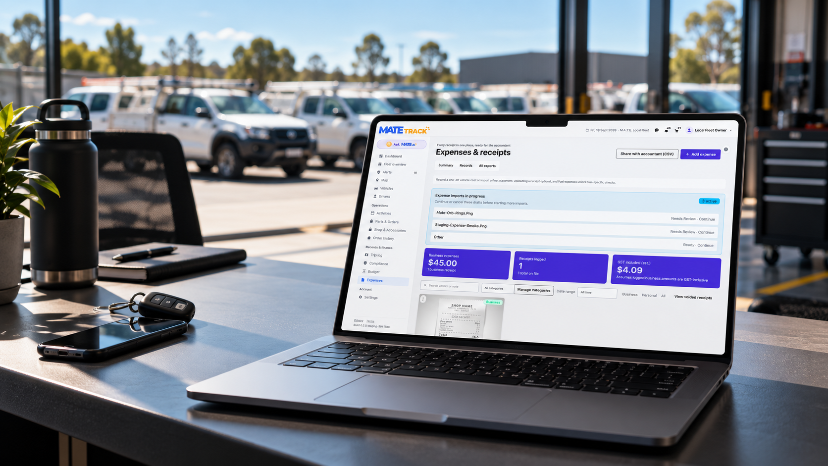 M.A.T.E. Track expenses and receipts on a laptop in a depot office, with the company's work utes parked outside